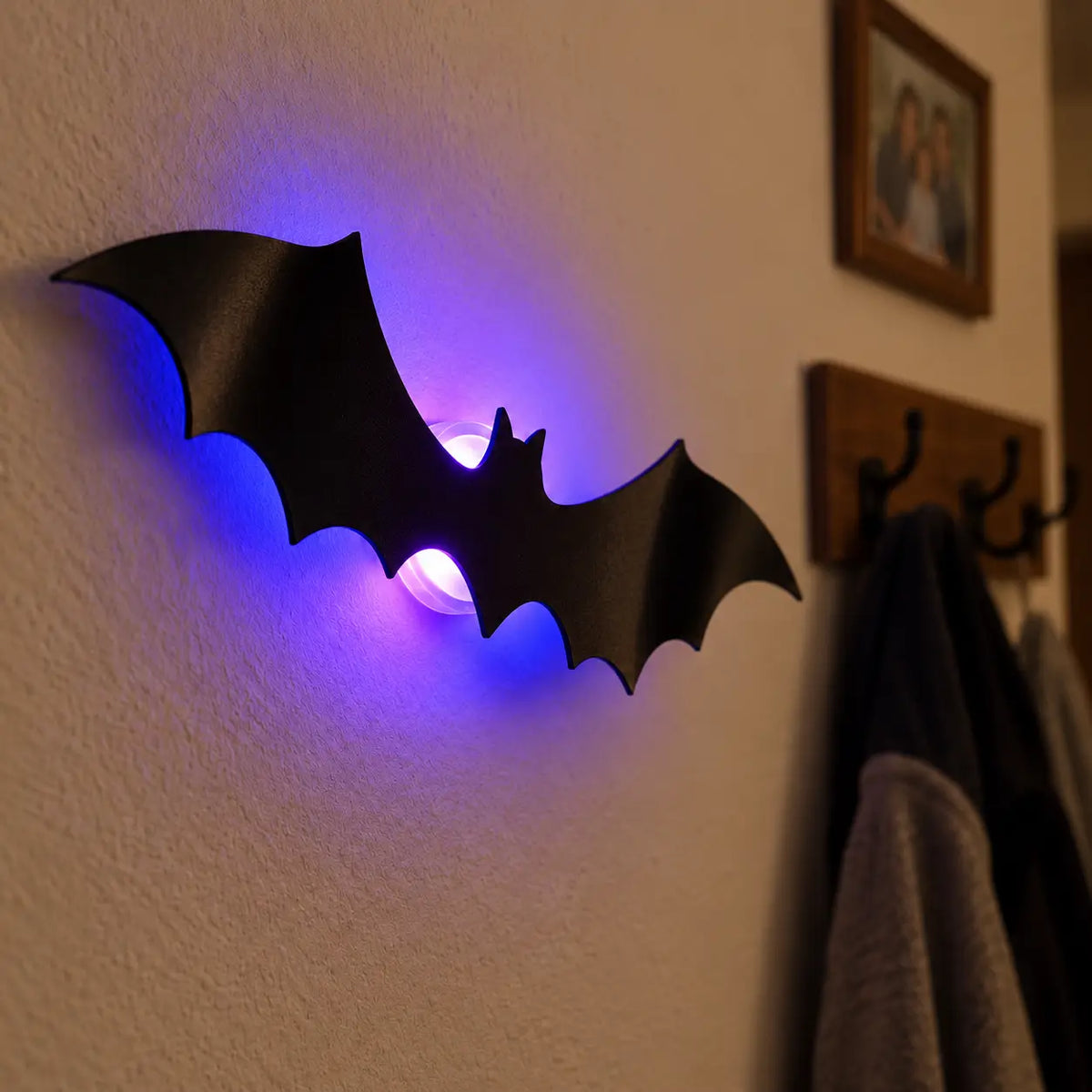 Close-up of one Midnight Swarm 3D bat light on a typical painted wall