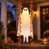 Spectral Swing illuminated ghost decoration hanging on an everyday American front porch at night